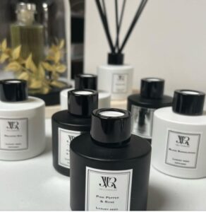 image of luxury reed diffusers in black and white bottles, with classic design label.