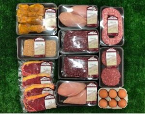 image showing various packs of freshg meat including sausages, burgers, chicken and game and a box of eggs.