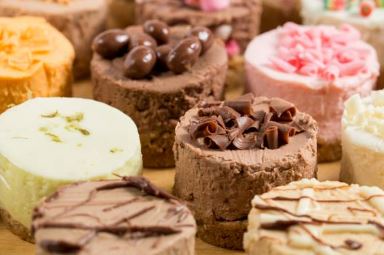 image of close up of bite sized cheesecake in a variety of flavours such as chocolate, orange, vanilla or strawberry.